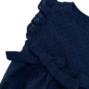 close up look of our navy blue baby girl romper 