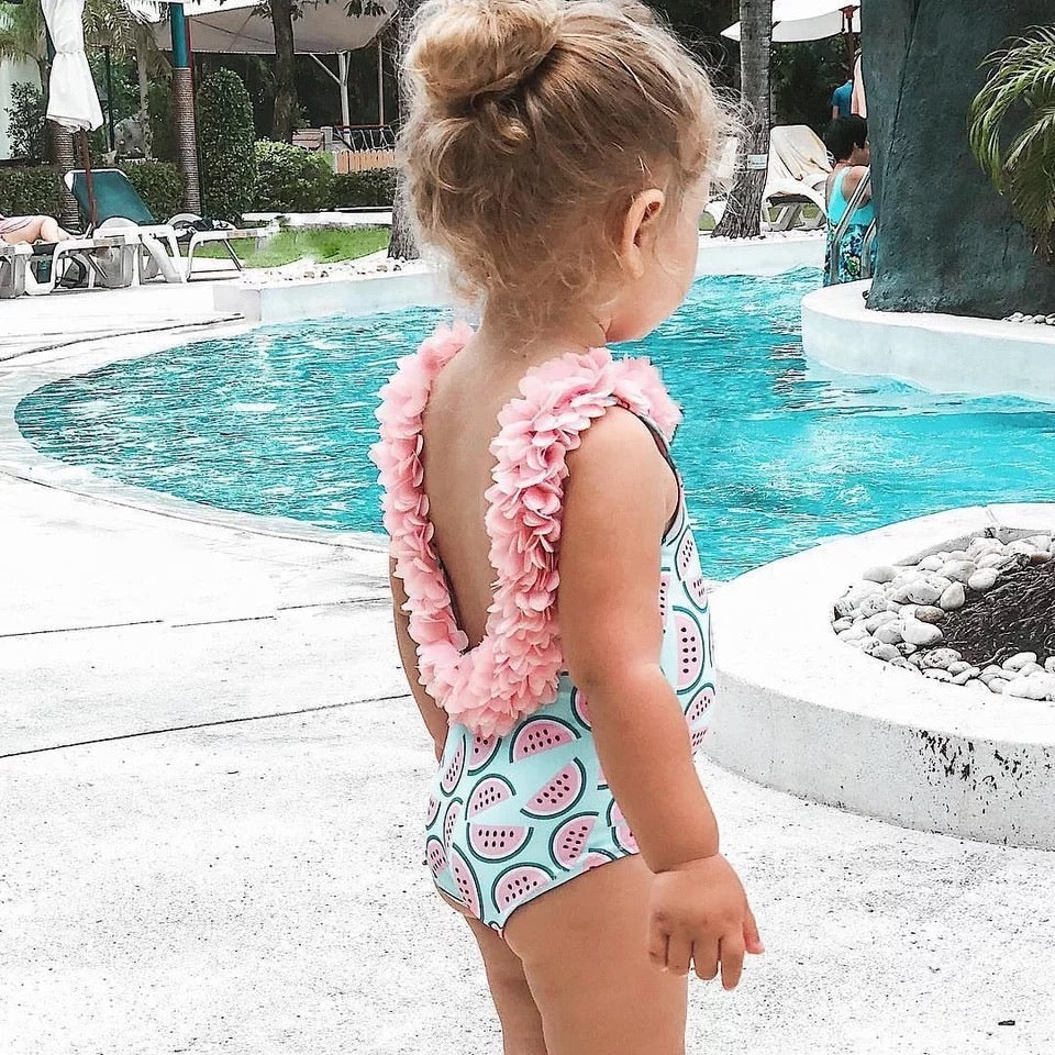 Toddler wearing our watermelon swimsuit